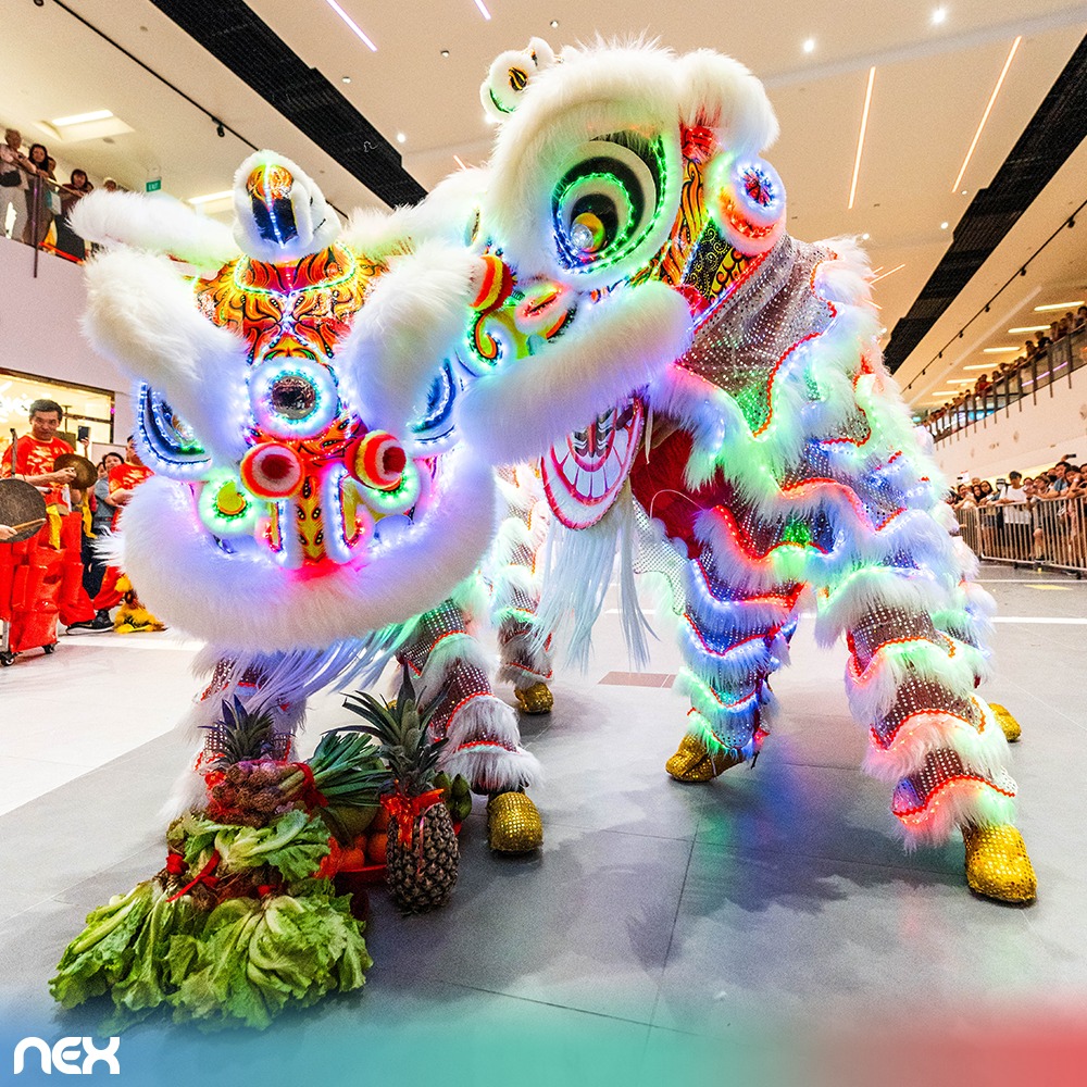 Performers leaping during the high-energy lion dance