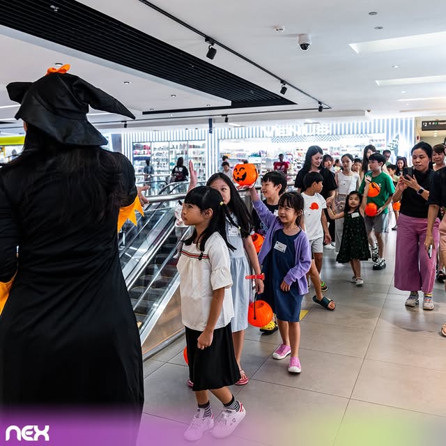 Children in Halloween costumes collecting treats