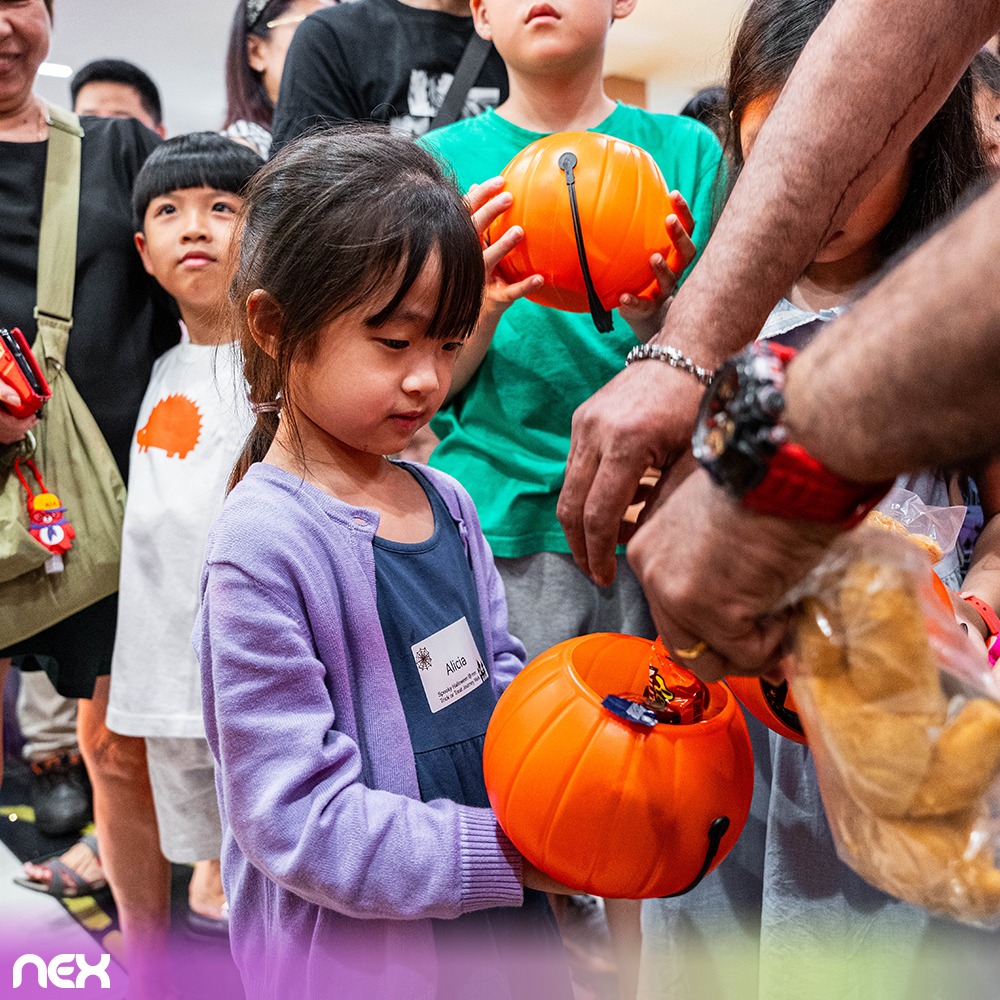 Children in festive Halloween costumes ready for trick-or-treating
