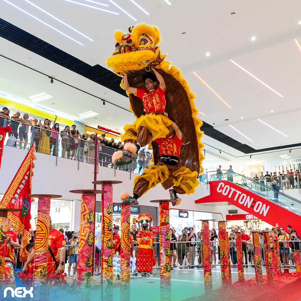 Traditional lion dance performance at NEX shopping mall